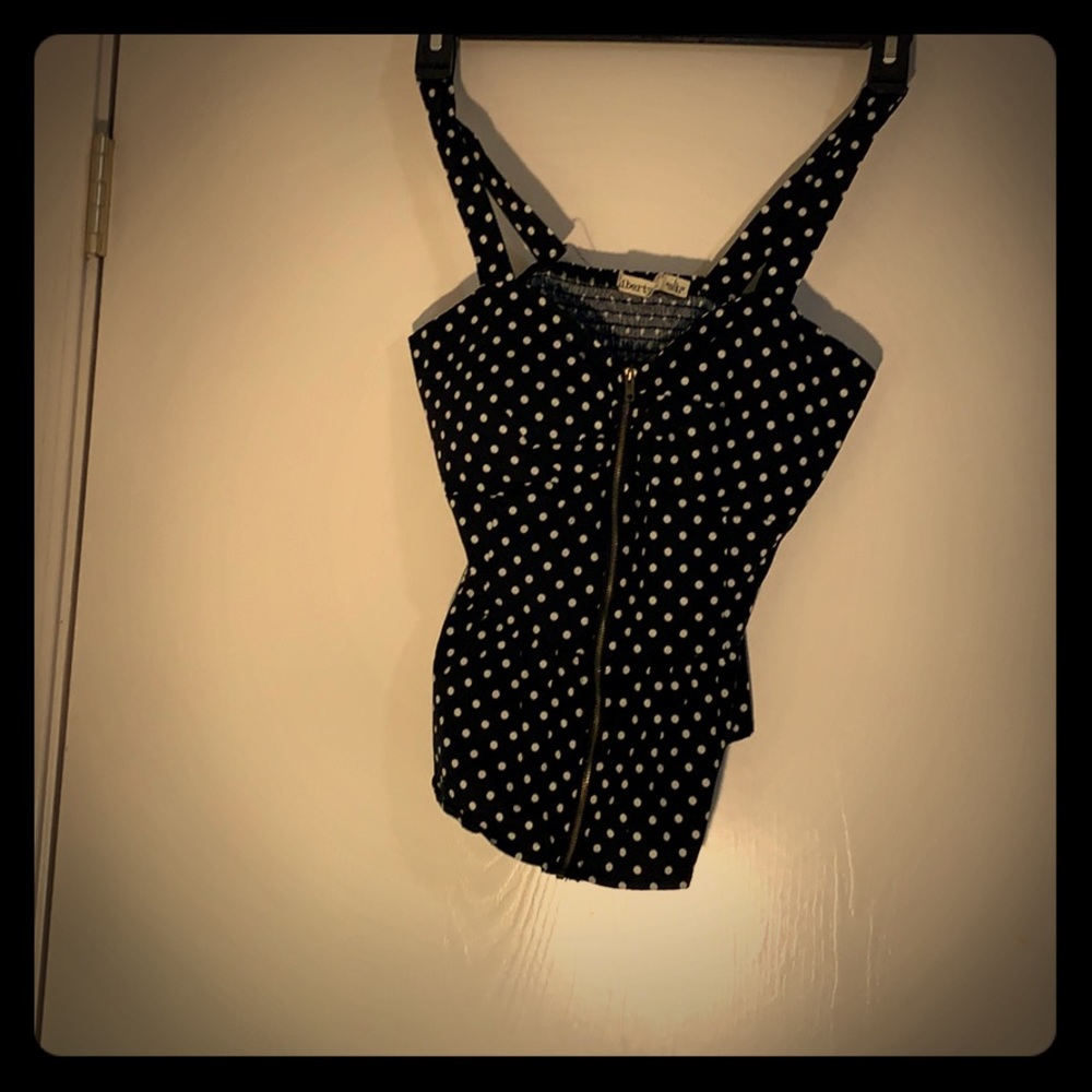 Black and white polkadot stretchy greaser shirt.